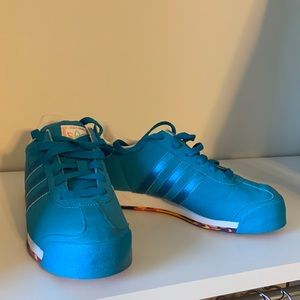 Blue Adidas samoas with multicolored soles